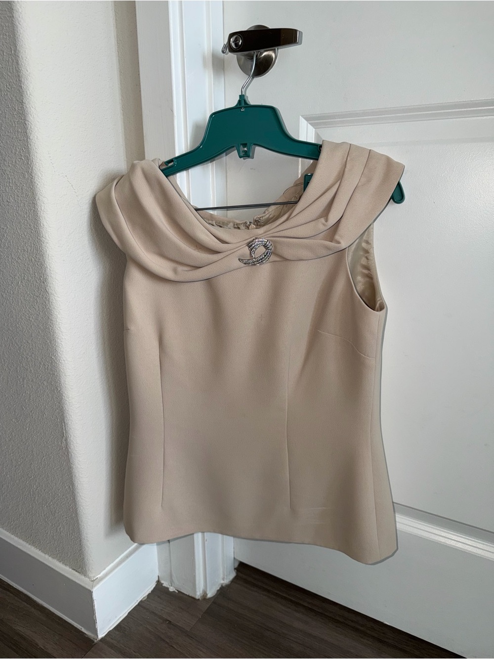 Sleeveless Cream Cowl Neck Top with Decorative Brooch